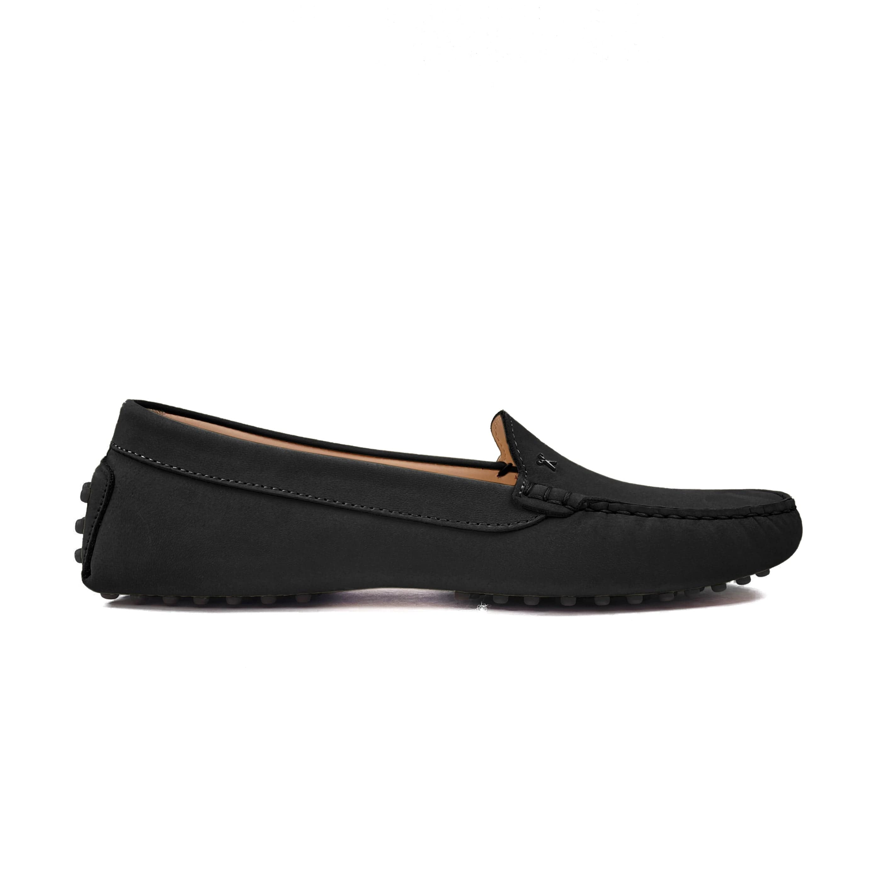 Driving shoe or moccasin in black italian nubuck leather with tan coloured calfskin lining. It has the iconic scissor on the right side of the vamp showing from the side on a white background