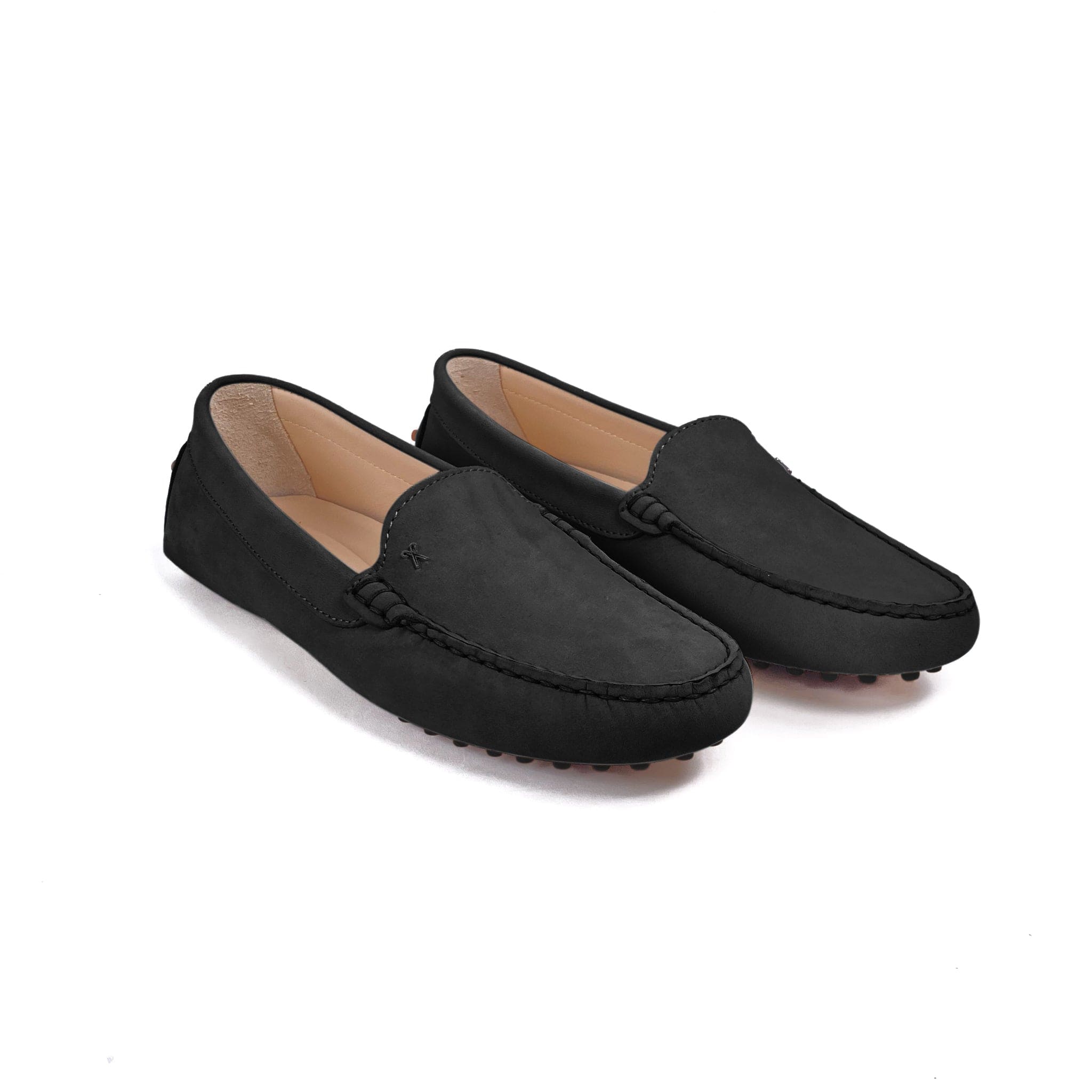 Driving shoe or moccasin in black italian nubuck leather with tan coloured calfskin lining. It has the iconic scissor on the right side of the vamp showing from the frontside on a white background