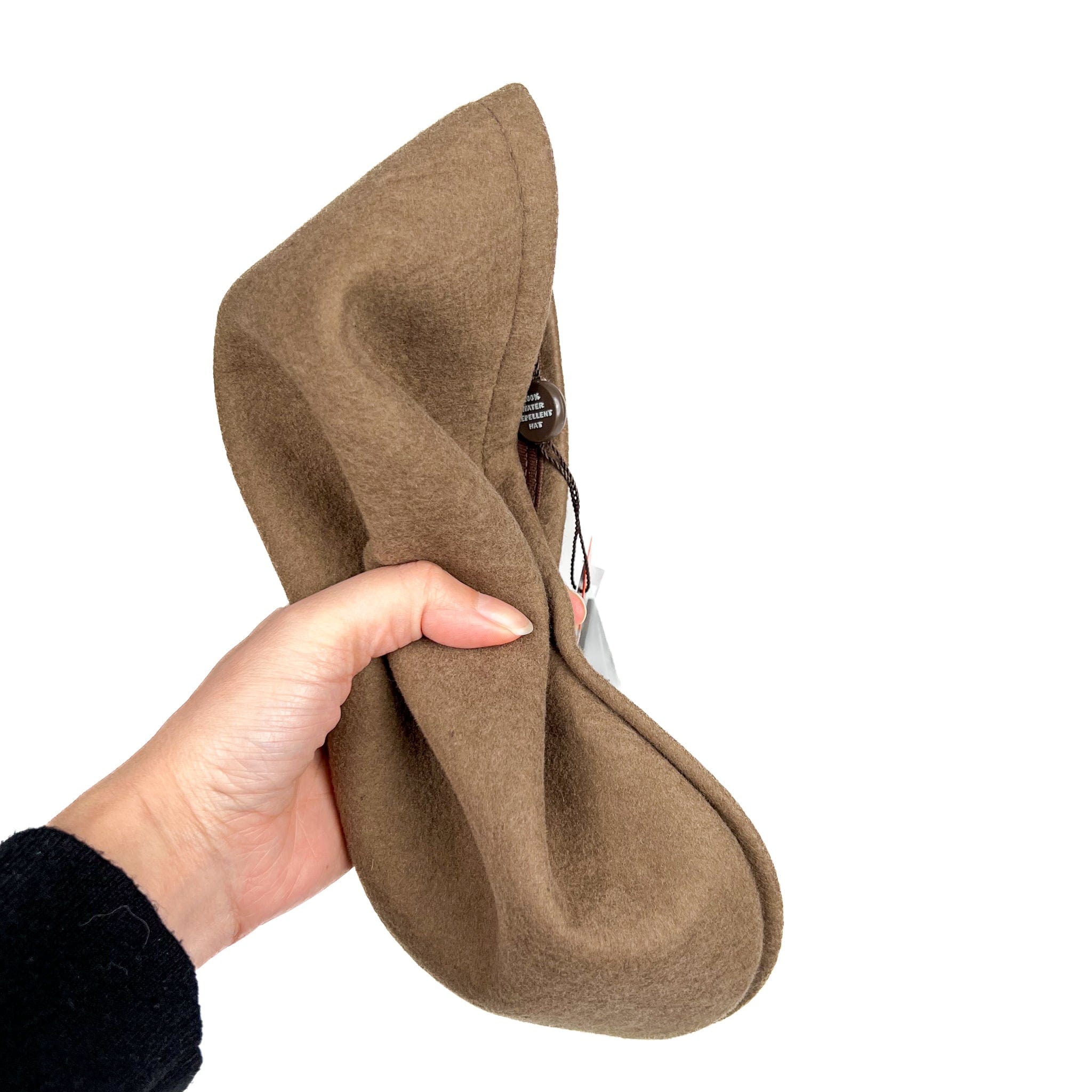 Virgin wool light felt fedora hat in tobacco with champagne gross grain ribbon and bow, with iconic  crafted society scissor on the left side. 100% virgin wool, water repellent and crushable. Crushed hat example